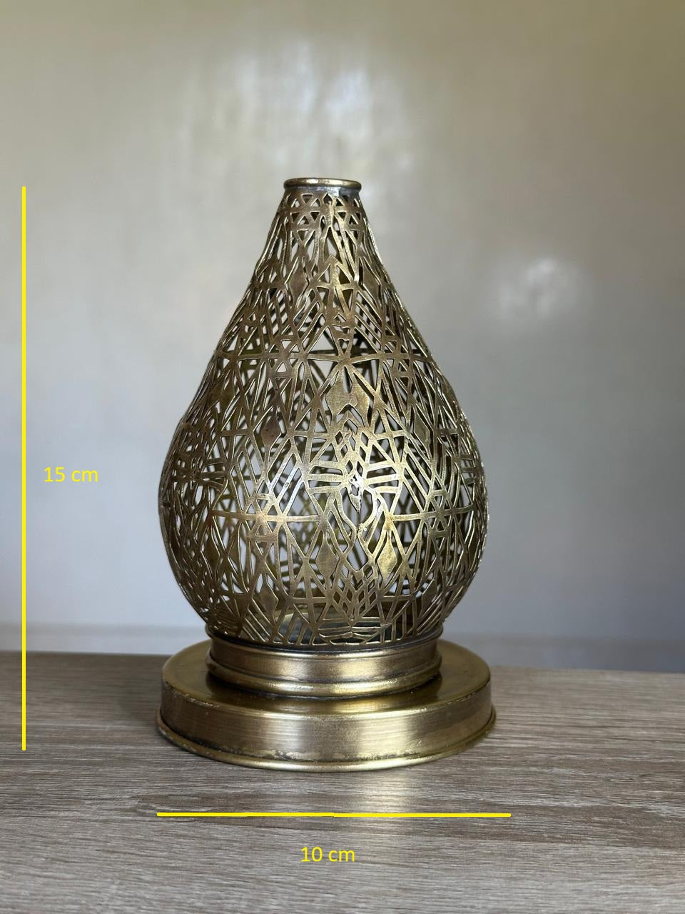 Handcrafted Brass Candle Holder with Teardrop Shape and Geometric Cutouts