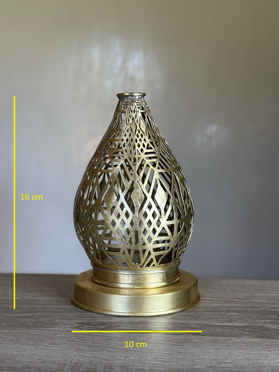 Handcrafted Brass Candle Holder with Teardrop Shape and Geometric Cutouts