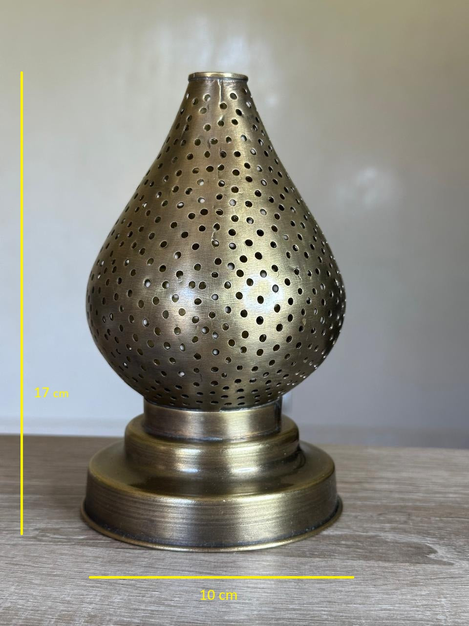 Handcrafted Brass Candle Holder with Teardrop Shape and Round Perforations