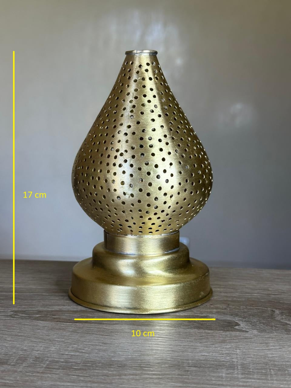 Handcrafted Brass Candle Holder with Teardrop Shape and Round Perforations