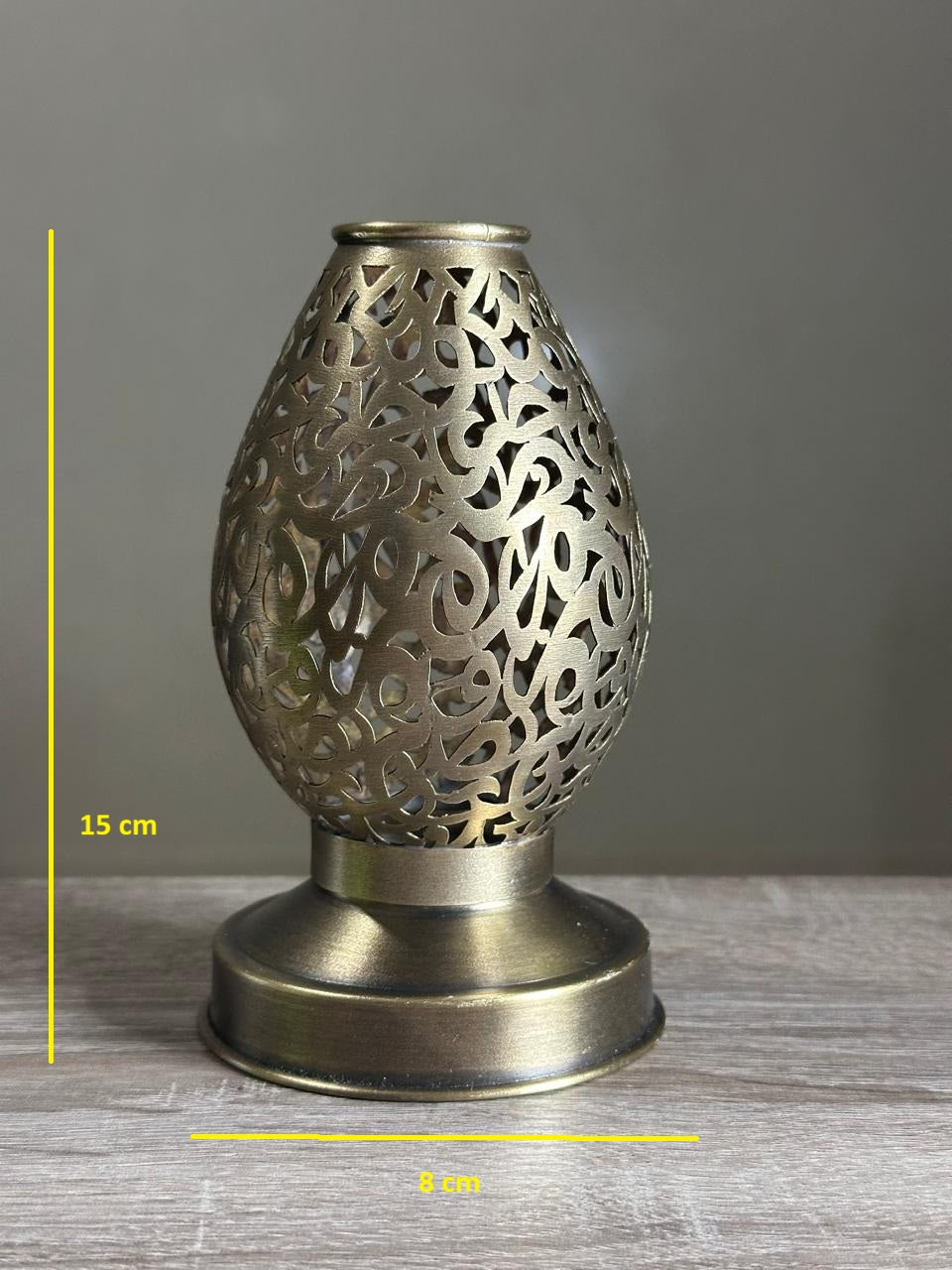 Handcrafted Brass Candle Holder with Teardrop Shape and Arabesque Cutouts