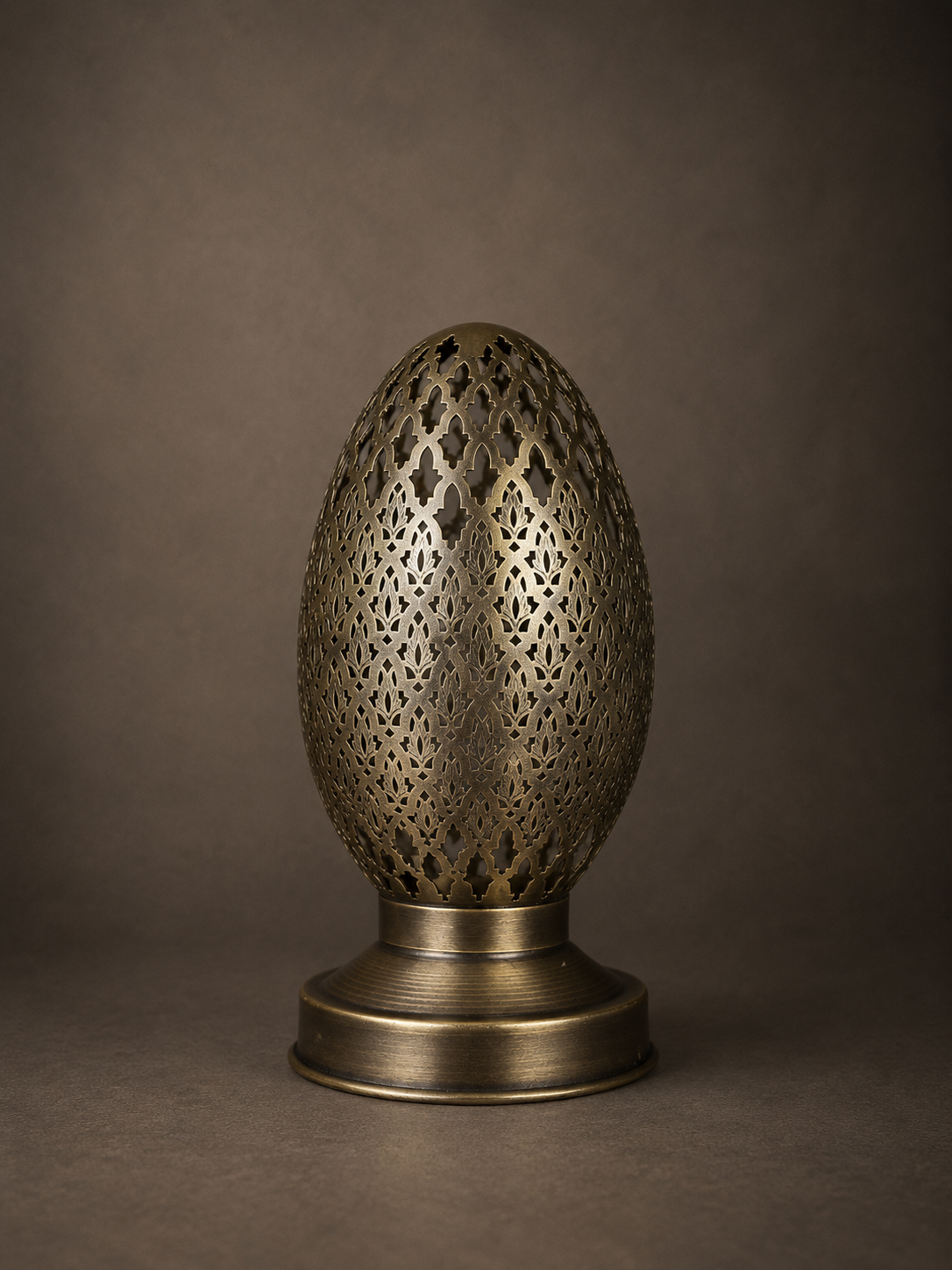 Handcrafted Brass Candle Holder with Oval Shape and Floral Lattice Cutouts