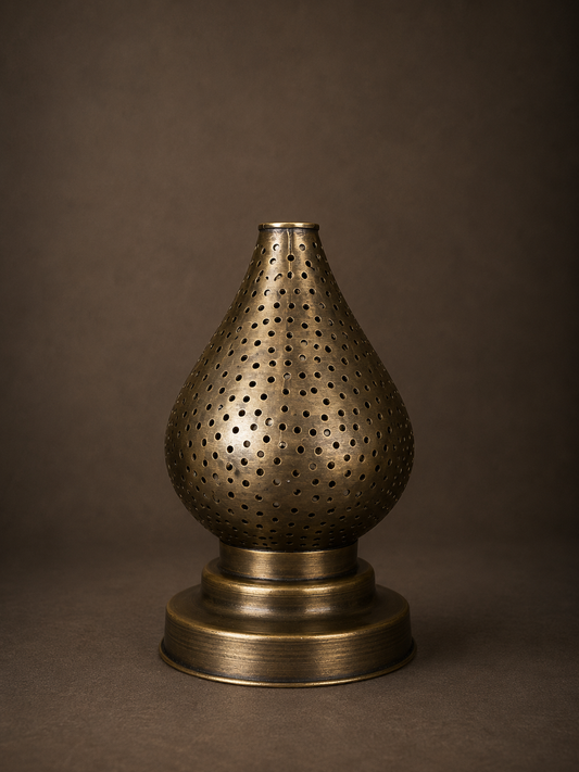 Handcrafted Brass Candle Holder with Teardrop Shape and Round Perforations