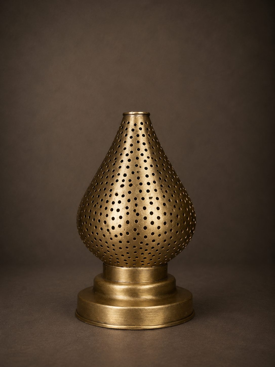 Handcrafted Brass Candle Holder with Teardrop Shape and Round Perforations
