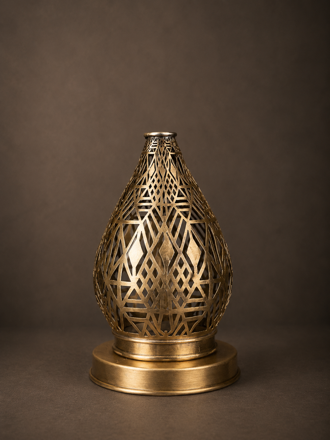 Handcrafted Brass Candle Holder with Teardrop Shape and Geometric Cutouts