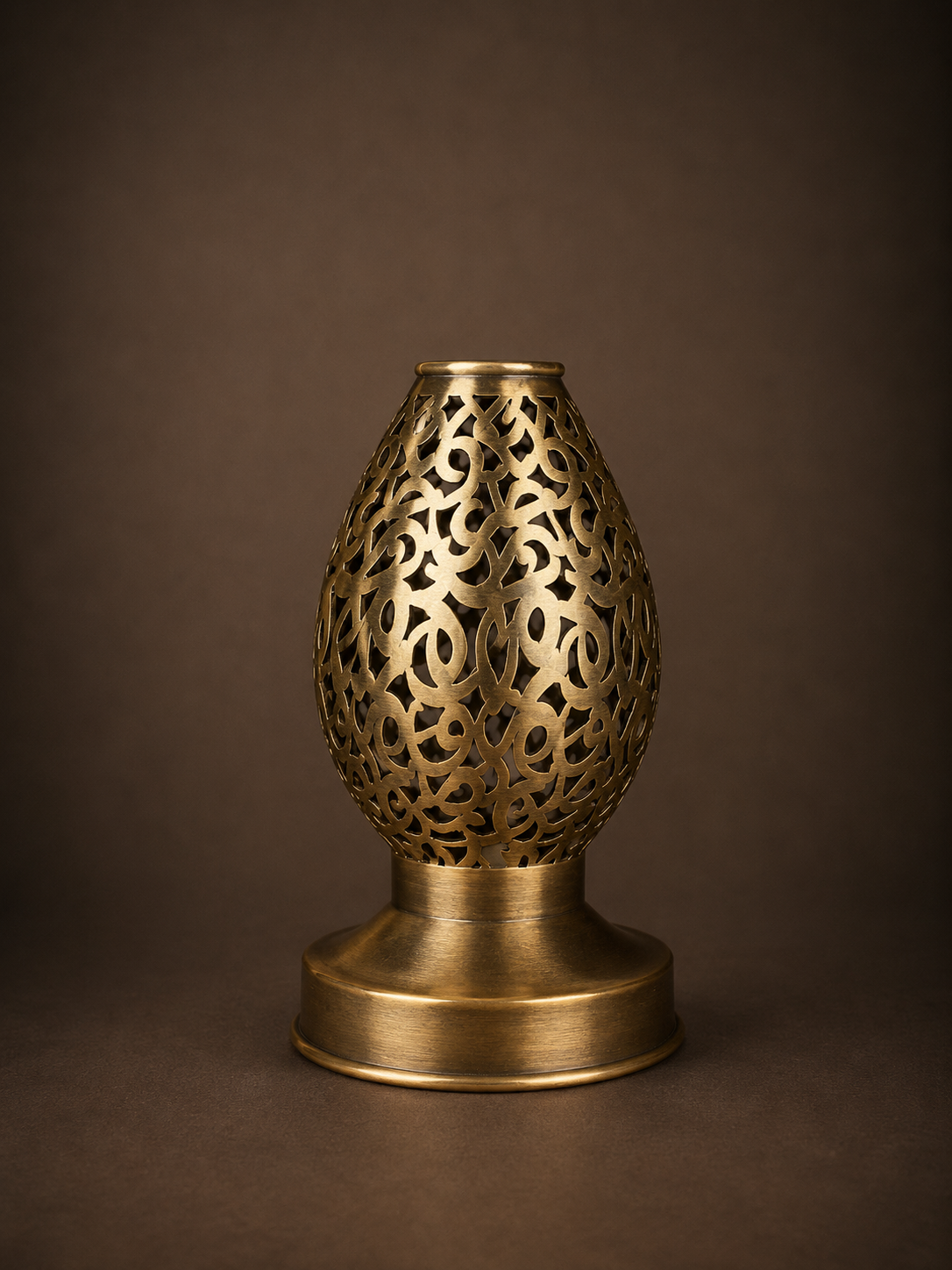 Handcrafted Brass Candle Holder with Teardrop Shape and Arabesque Cutouts
