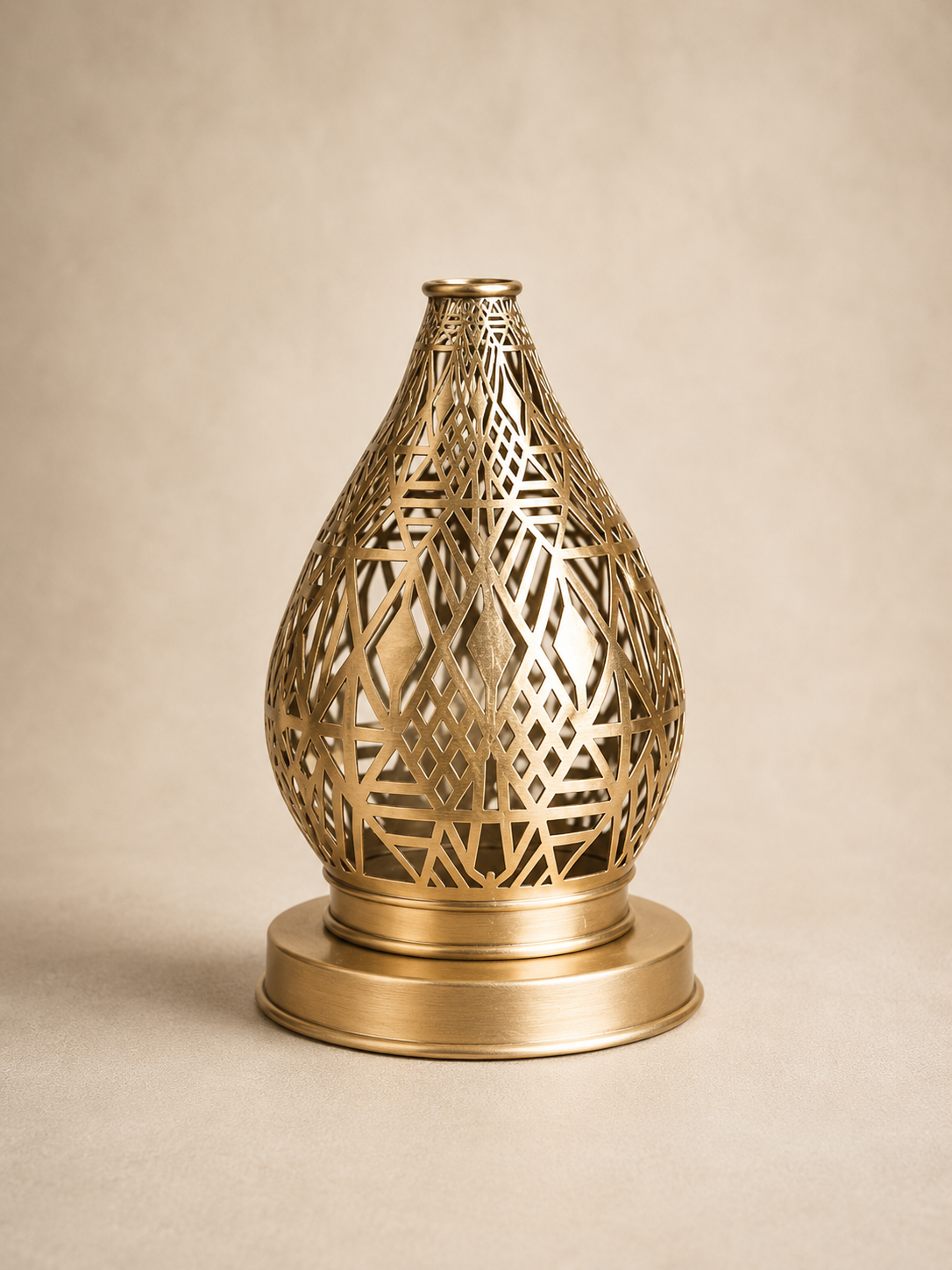 Handcrafted Brass Candle Holder with Teardrop Shape and Geometric Cutouts