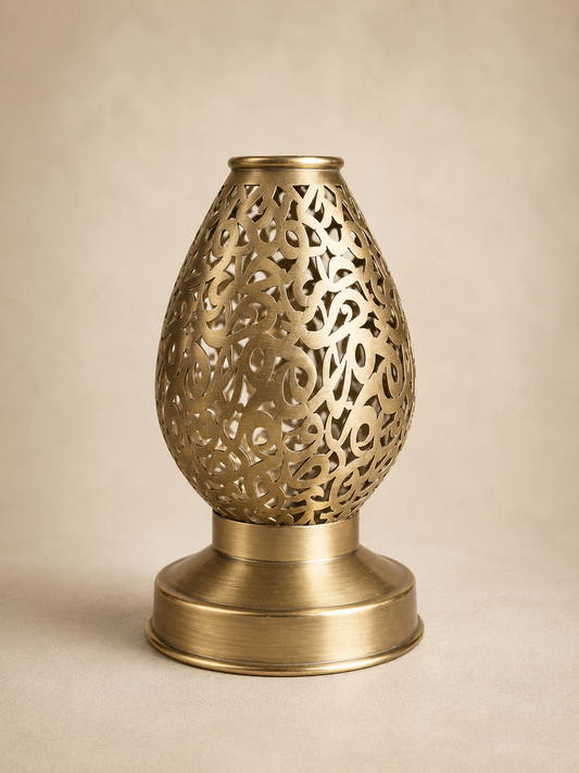 Handcrafted Brass Candle Holder with Teardrop Shape and Arabesque Cutouts