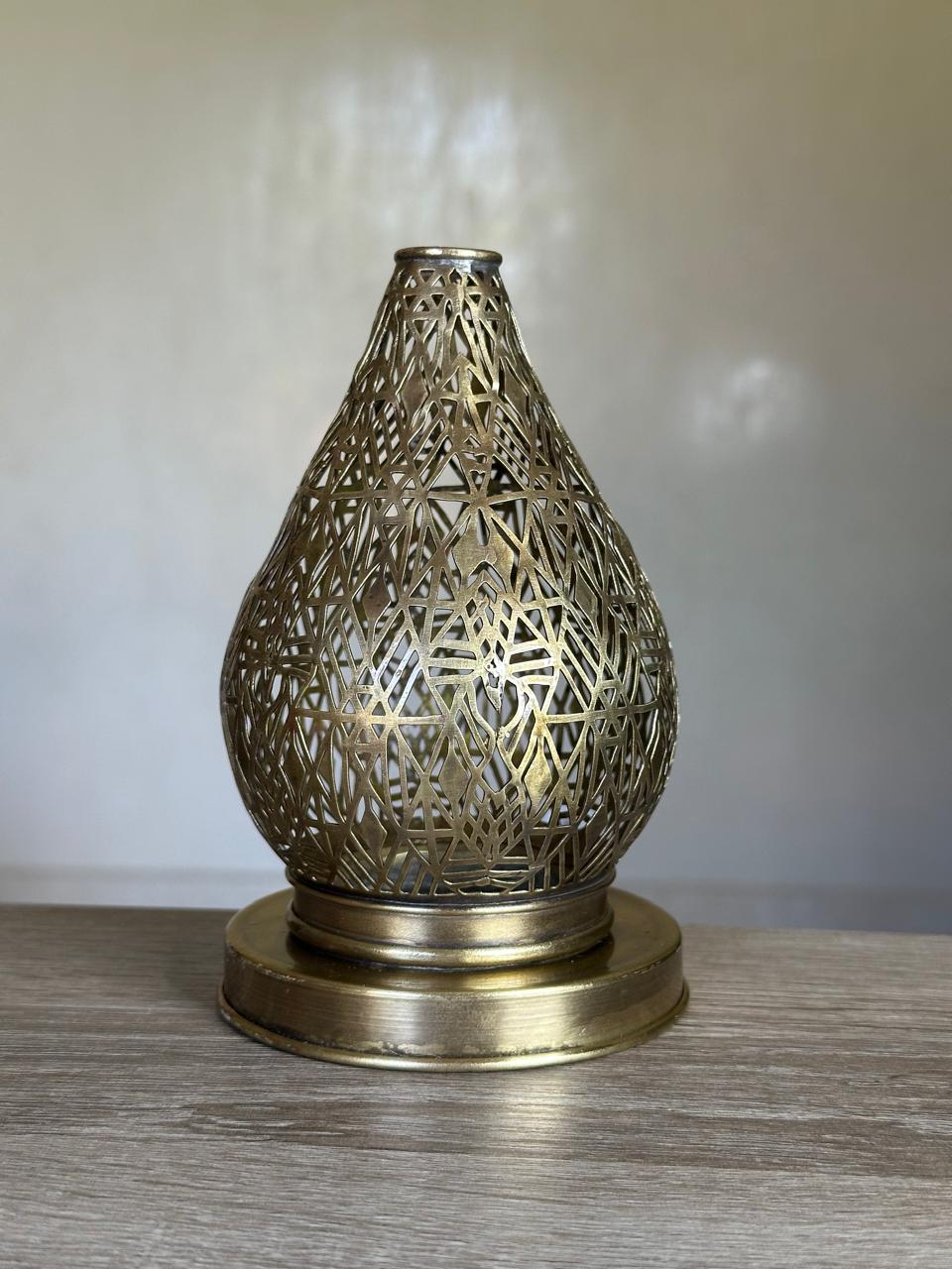Handcrafted Brass Candle Holder with Teardrop Shape and Geometric Cutouts
