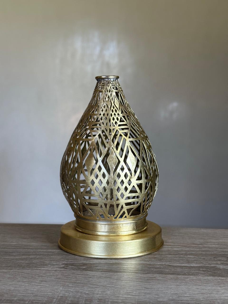Handcrafted Brass Candle Holder with Teardrop Shape and Geometric Cutouts