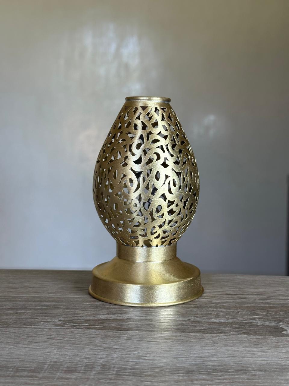 Handcrafted Brass Candle Holder with Teardrop Shape and Arabesque Cutouts