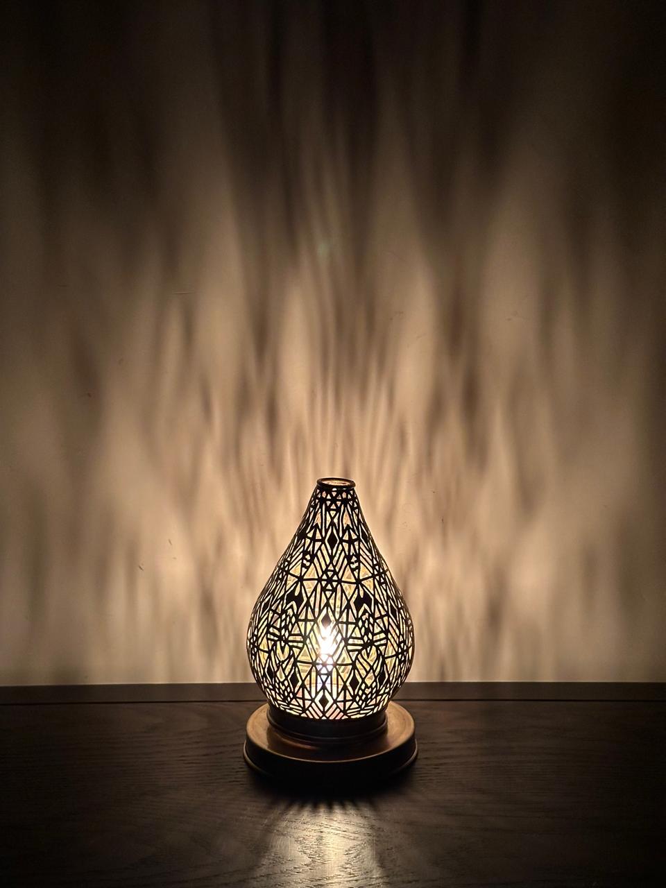 Handcrafted Brass Candle Holder with Teardrop Shape and Geometric Cutouts