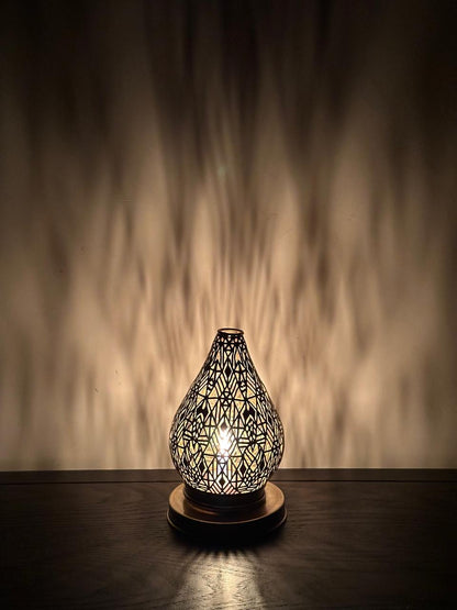 Handcrafted Brass Candle Holder with Teardrop Shape and Geometric Cutouts