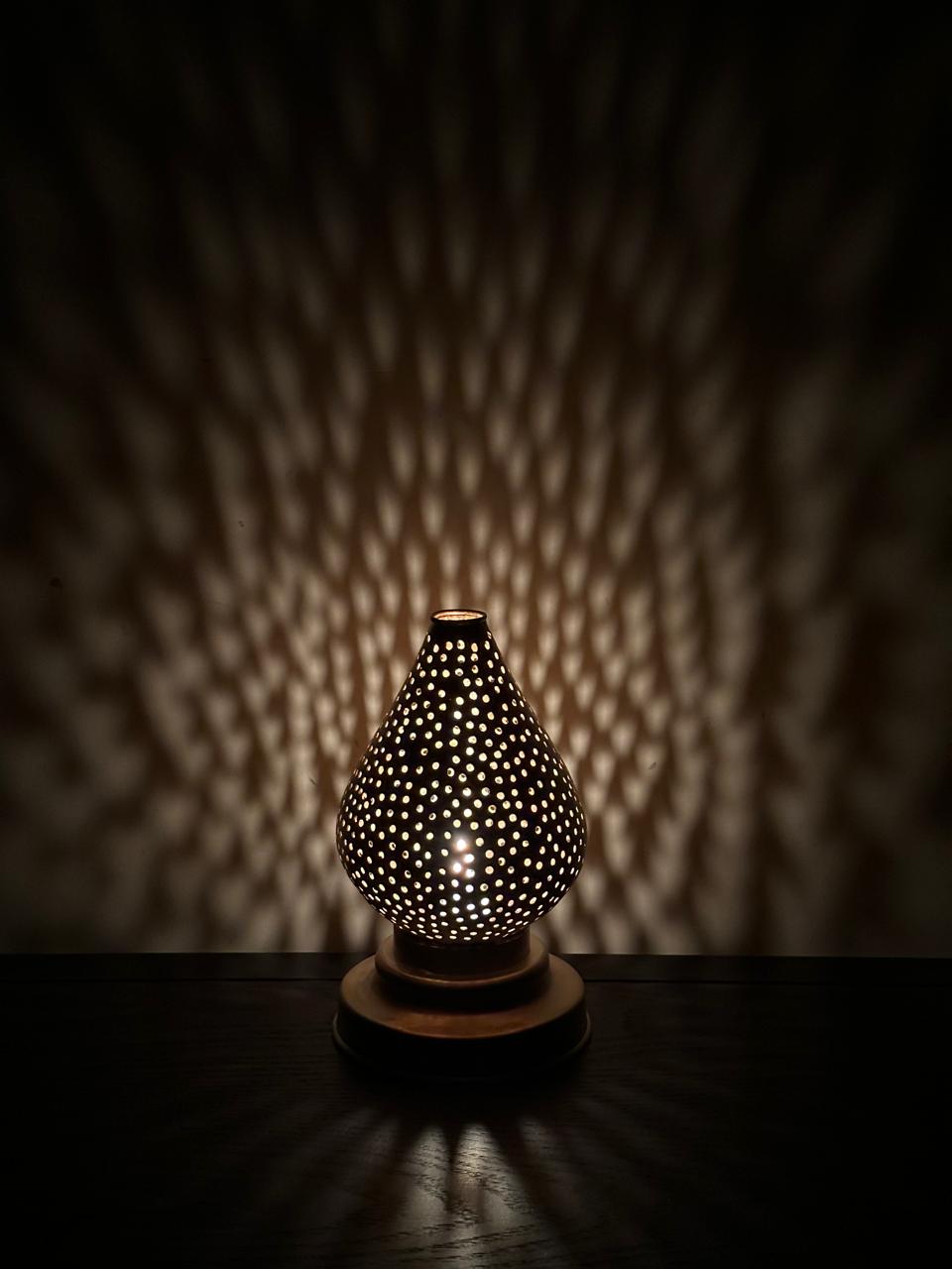 Handcrafted Brass Candle Holder with Teardrop Shape and Round Perforations