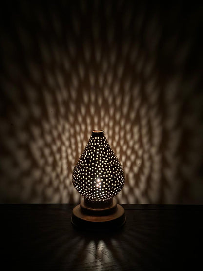 Handcrafted Brass Candle Holder with Teardrop Shape and Round Perforations