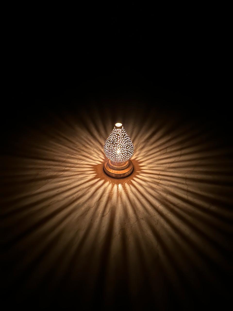 Handcrafted Brass Candle Holder with Teardrop Shape and Round Perforations